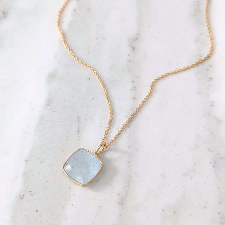 gold plated sterling silver blue topaz cushion pendant necklace
