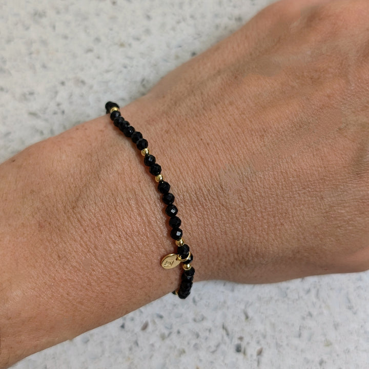 black tourmaline and gold bead gemstone bracelet