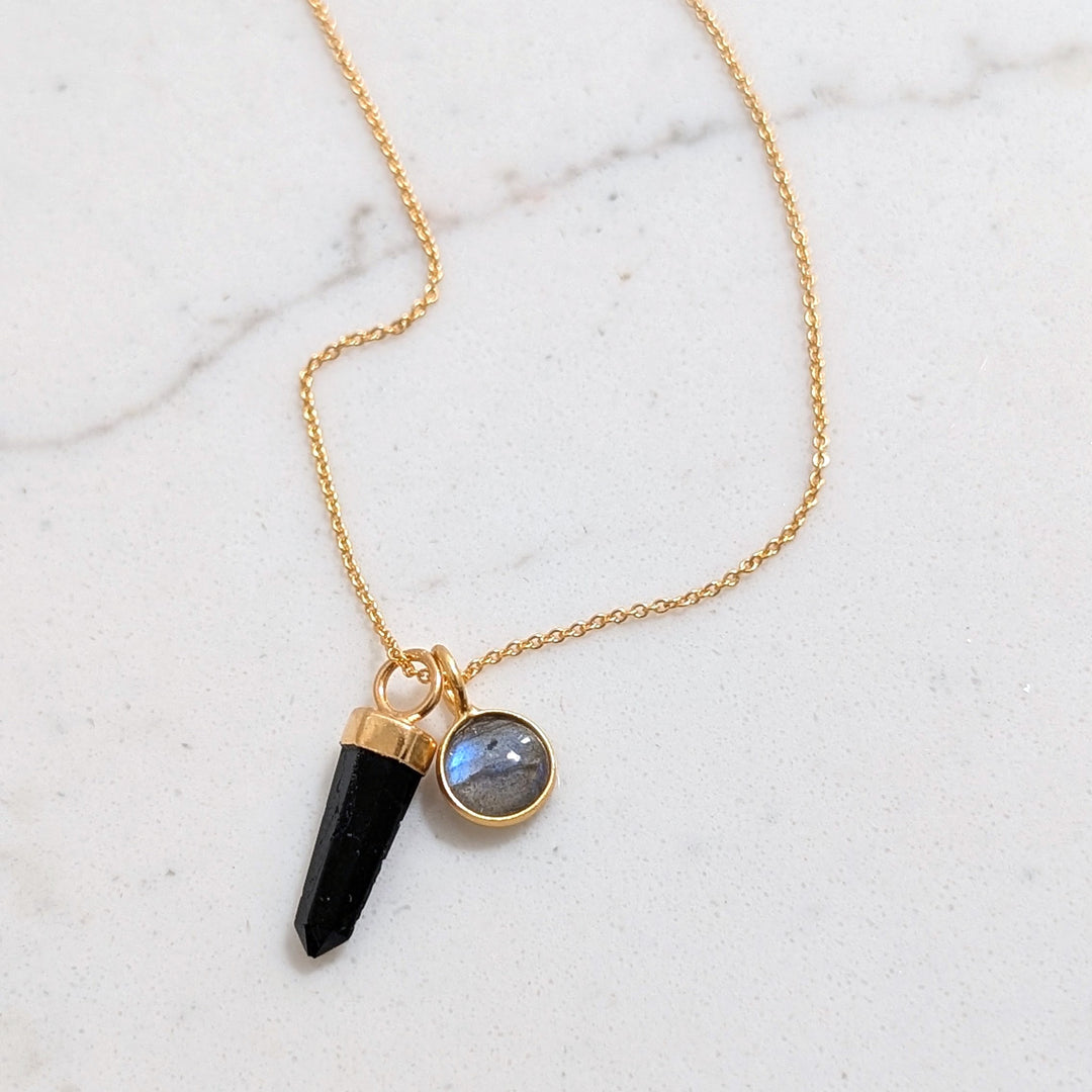 gold necklace with black tourmaline gemstone point pendant and labradorite charm
