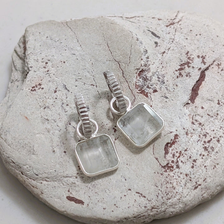 sterling silver blue topaz square charm hoop earrings