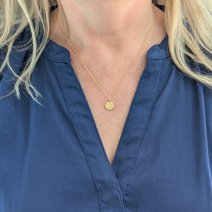 gold  chain with Lapis London logo disc charm