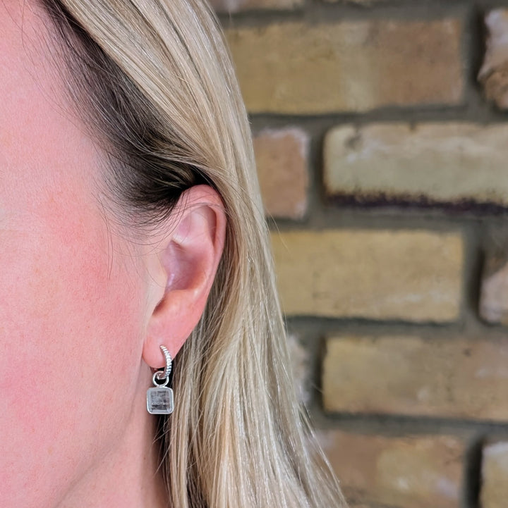 Sterling silver light blue topaz square charm earrings