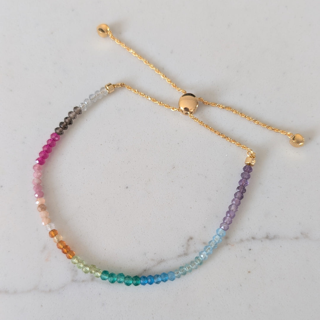 Multicolored rainbow gemstone beaded bracelet on a gold chain