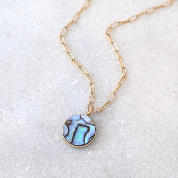 gold circular abalone shell pendant necklace on paperclip chain
