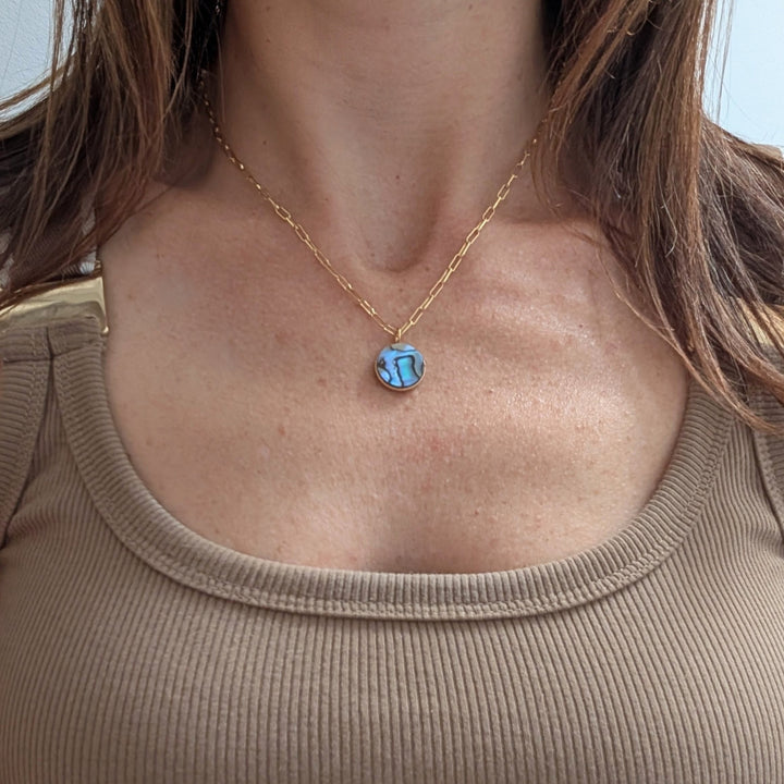 gold circular abalone shell pendant necklace on paperclip chain