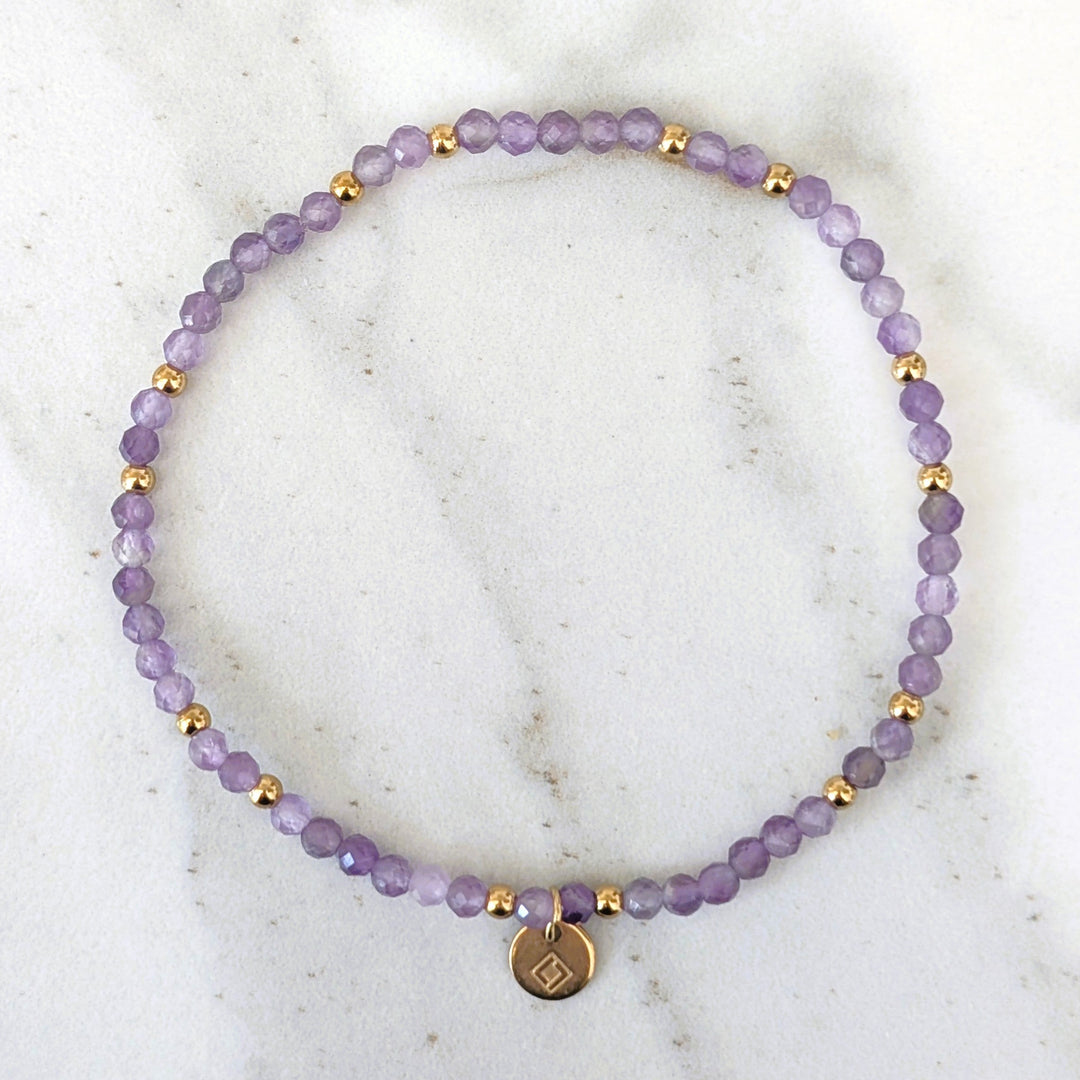 purple amethyst February birthstone gemstone and gold bead bracelet 