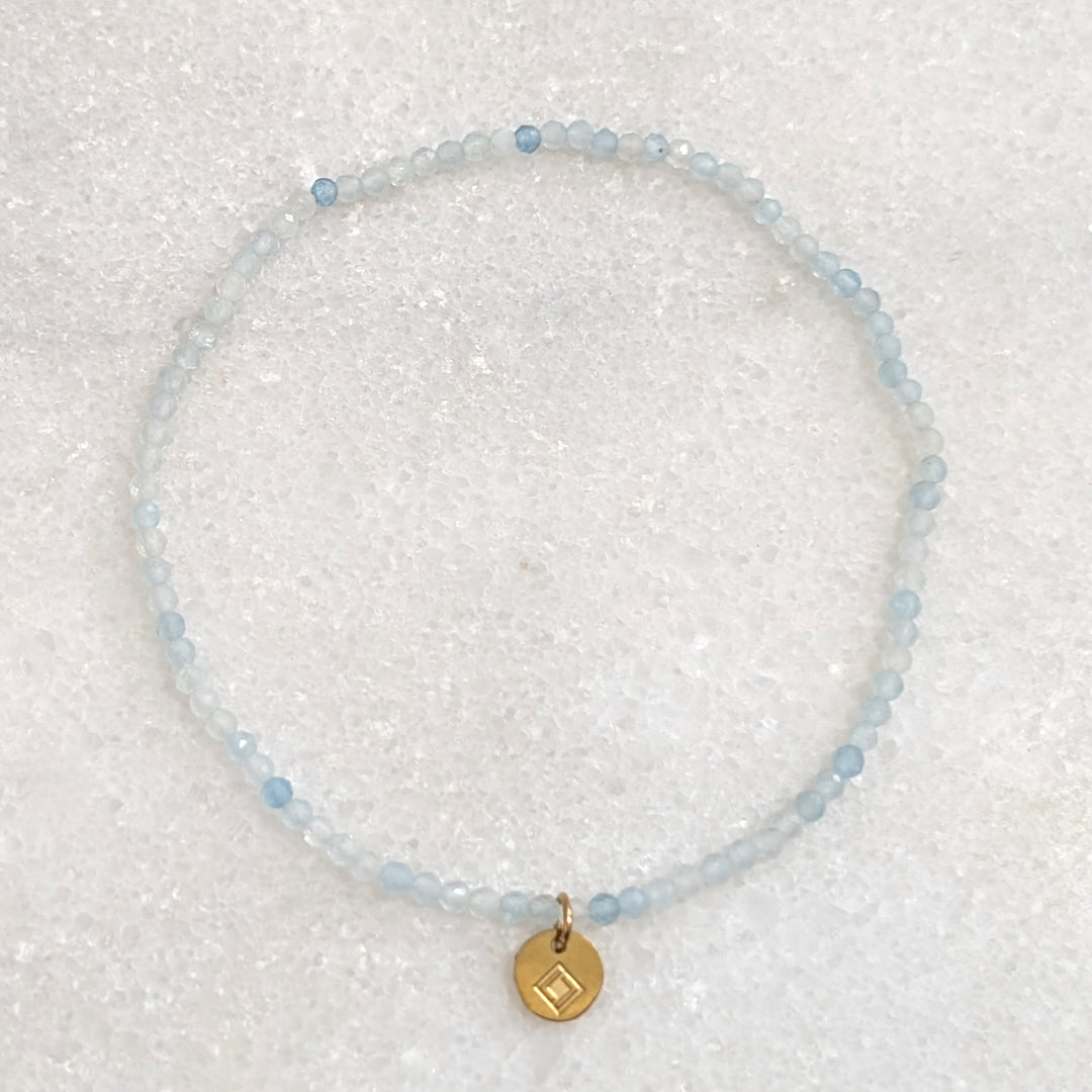 skinny aquamarine gemstone bracelet with 2mm faceted beads