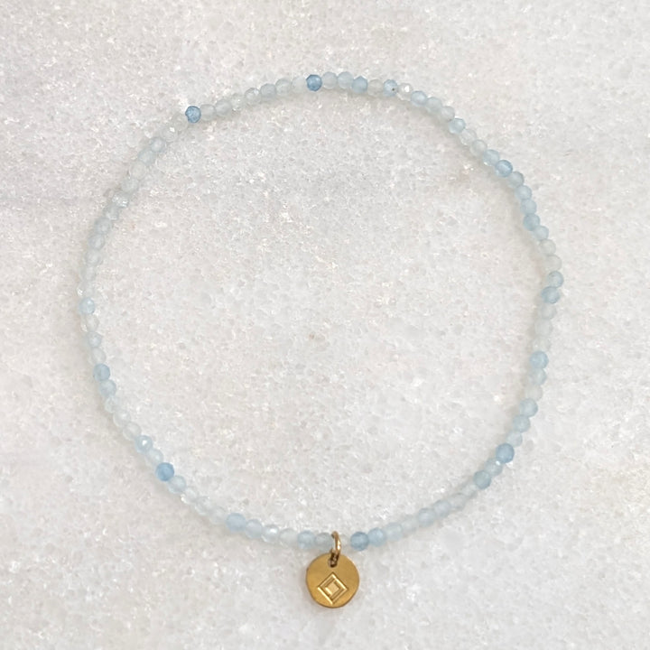 skinny aquamarine gemstone bracelet with 2mm faceted beads