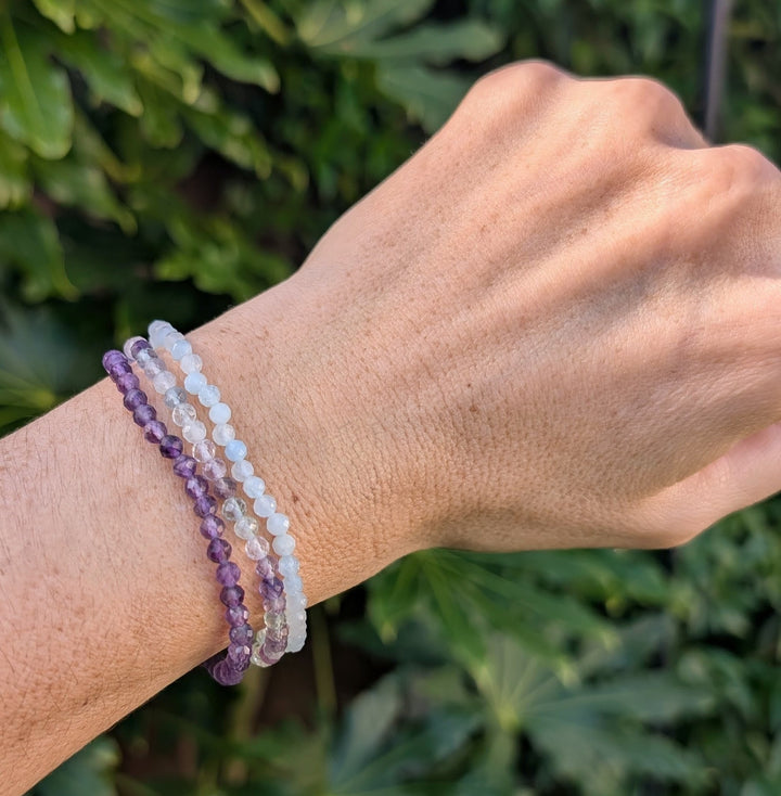 Aquarius gemstone bracelet set comprising amethyst, aquamarine and fluorite gemstone bracelets.