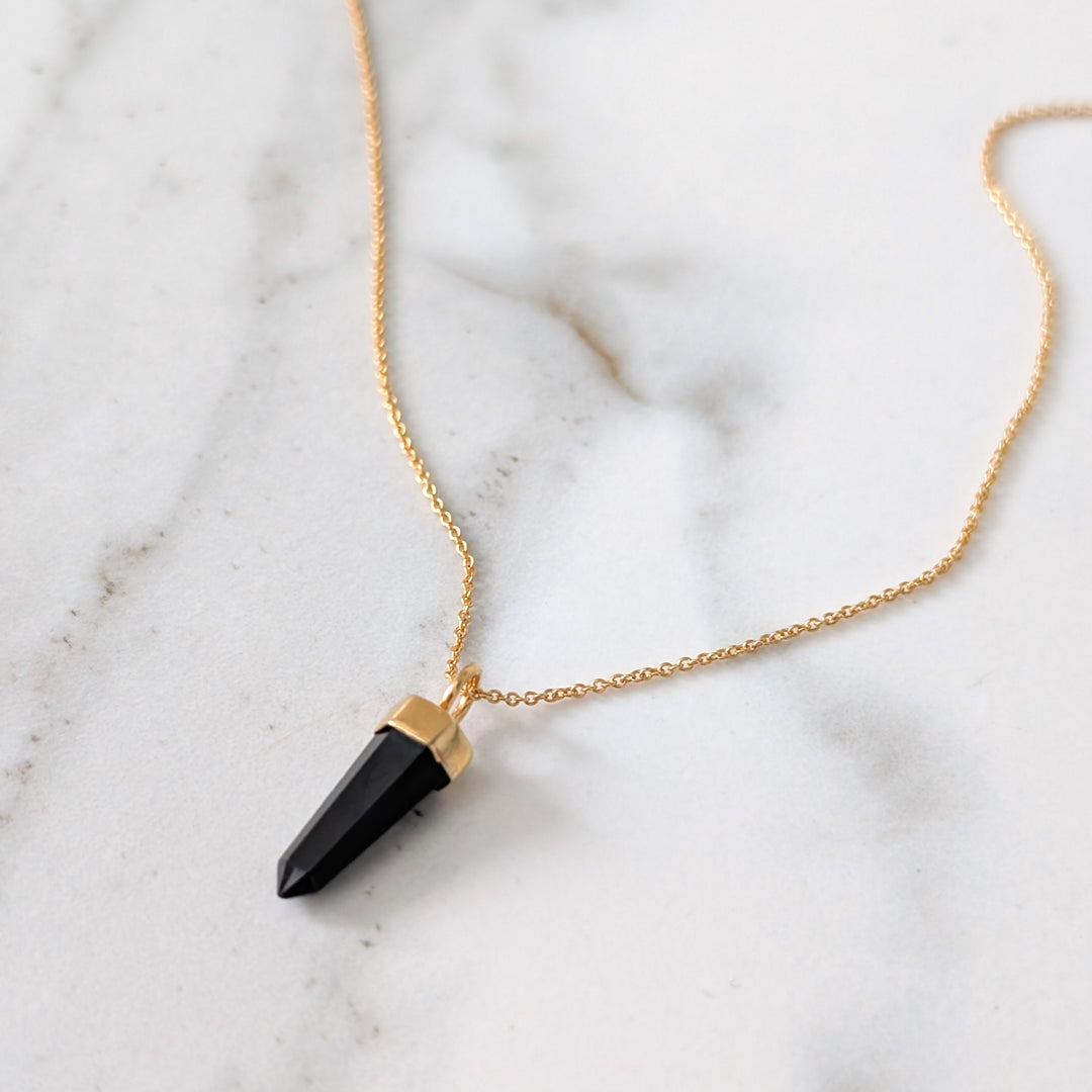 gold necklace with black tourmaline gemstone point pendant