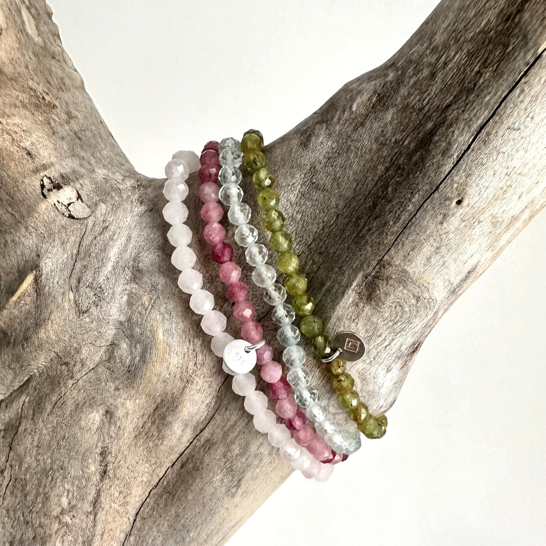 Celebrate friendship gemstone intention bracelet set. Peridot, rose quartz, blue topaz and peridot gemstone bracelets. 