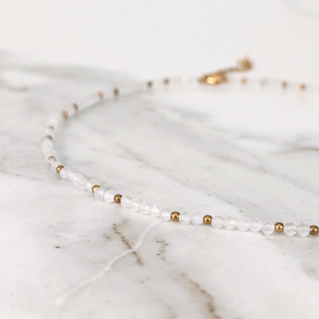 clear quartz gemstone and gold bead necklace 