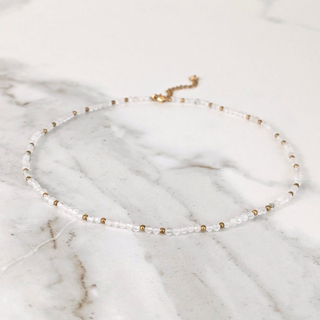 clear quartz gemstone and gold bead necklace 