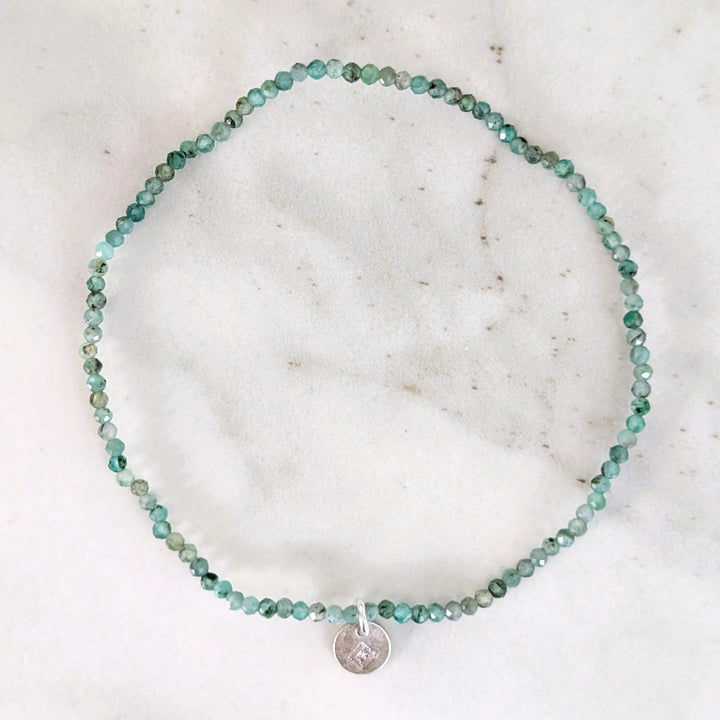 Green emerald 2mm faceted bead bracelet with a sterling silver disc