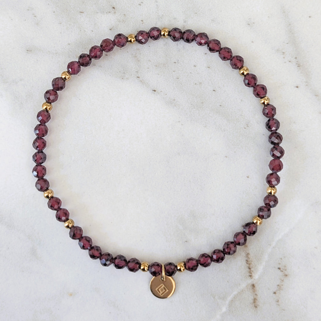 garnet January birthstone gemstone and gold bead bracelet 