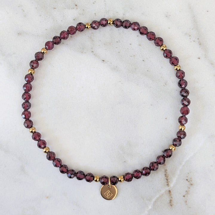 garnet January birthstone gemstone and gold bead bracelet 