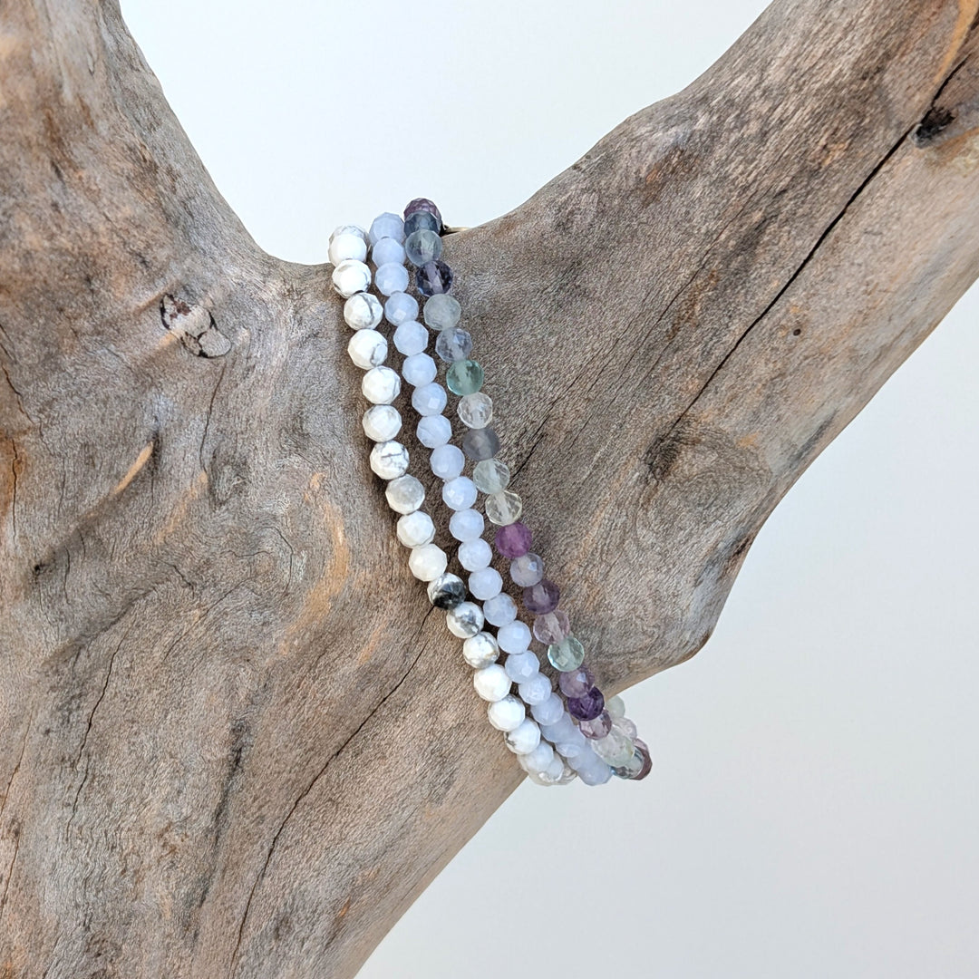 Gemini zodiac gemstone bracelet set comprising white howlite, fluorite and blue lace agate.