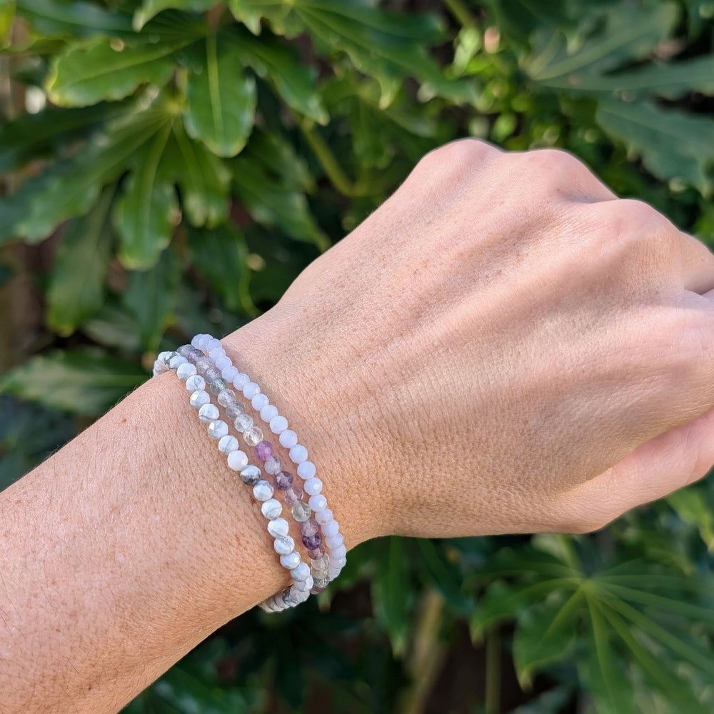 Gemini zodiac gemstone bracelet set comprising white howlite, fluorite and blue lace agate.