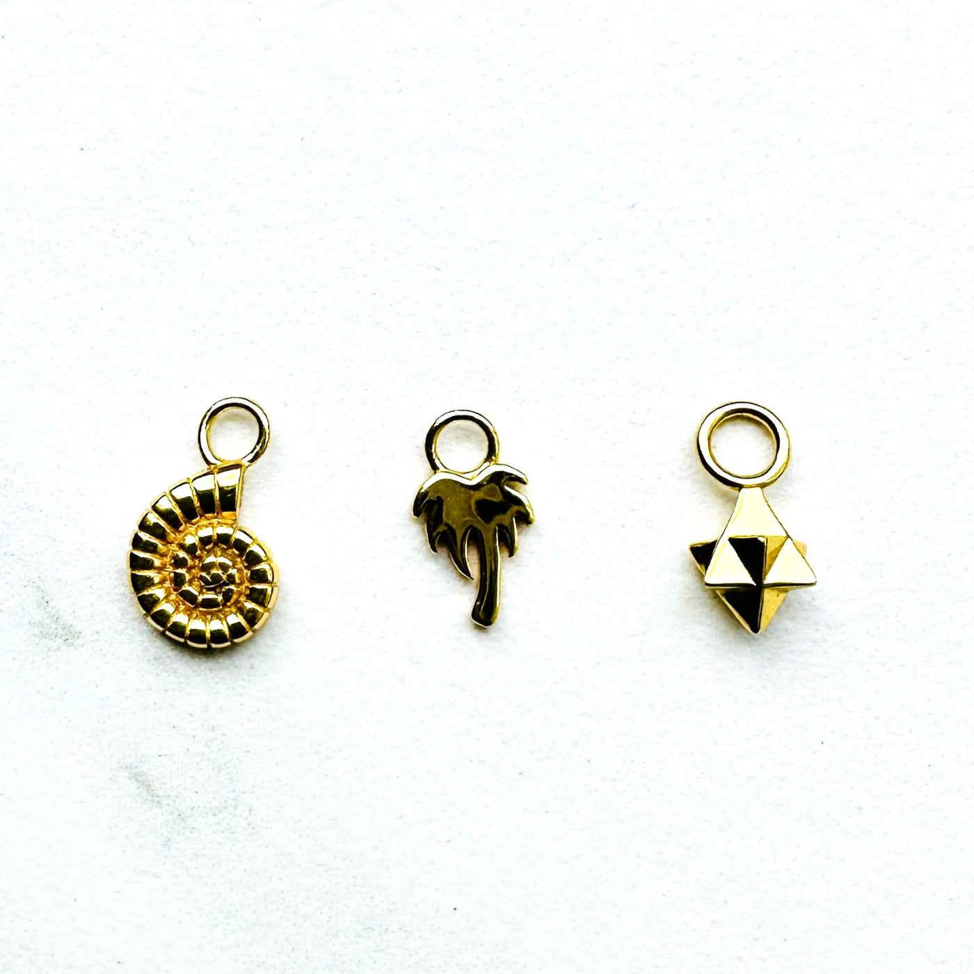 ammonite, palm tree and tetrahedron star gold necklace charms