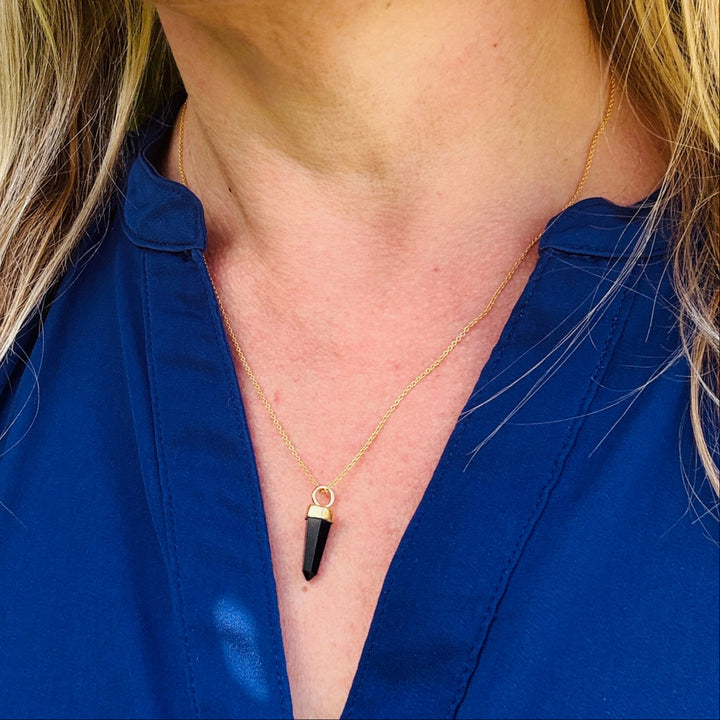 gold necklace with black tourmaline gemstone point pendant