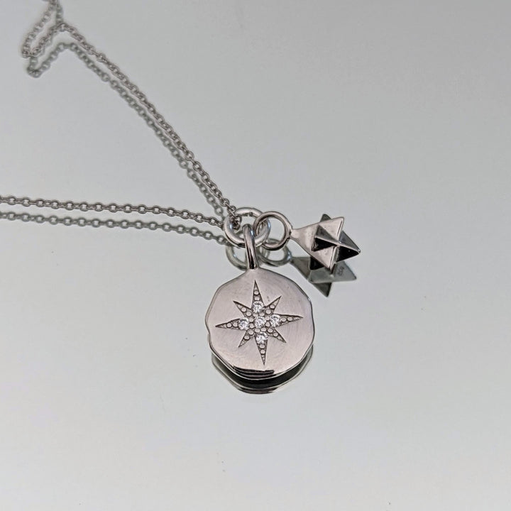 silver star disc and charm necklace
