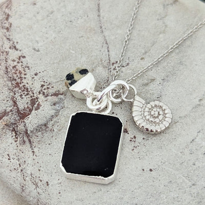 Black Onyx, Dalmatian Jasper, and ammonite charm silver pendant necklace