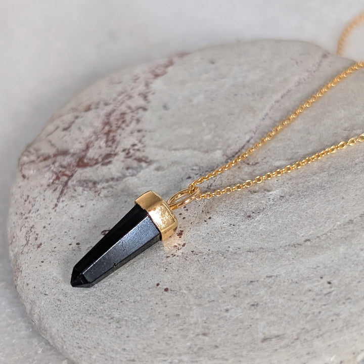 gold necklace with black tourmaline gemstone point pendant