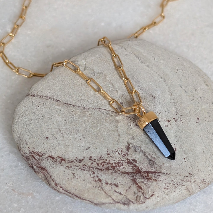 gold paperclip necklace with black tourmaline gemstone point pendant