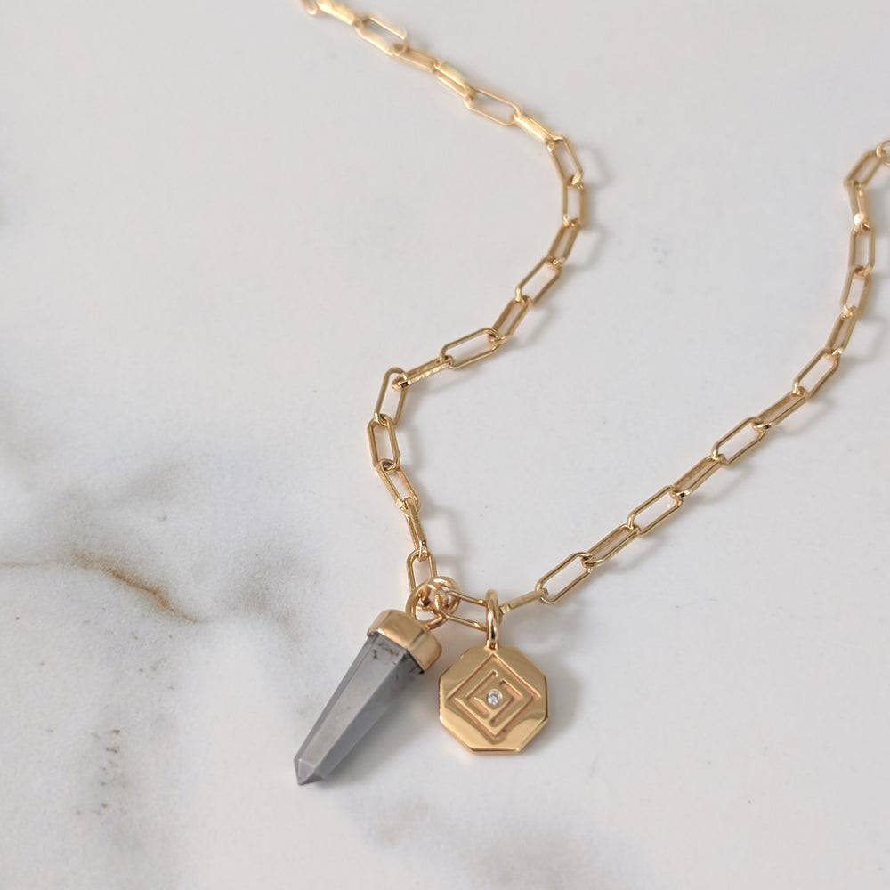 gold paperclip necklace with pyrite gemstone point pendant and gold disc charm