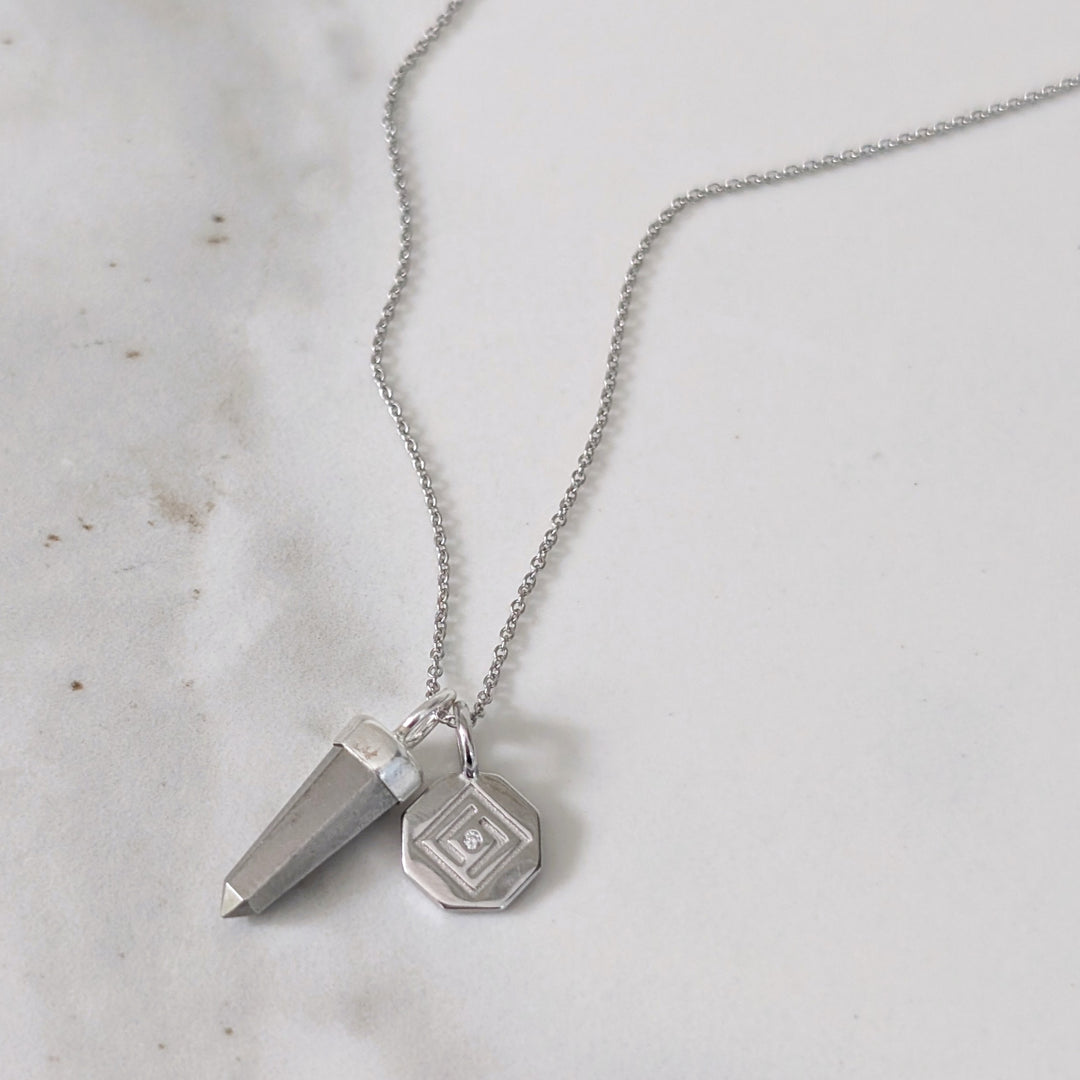 Silver necklace with a pyrite spike pendant and silver disc