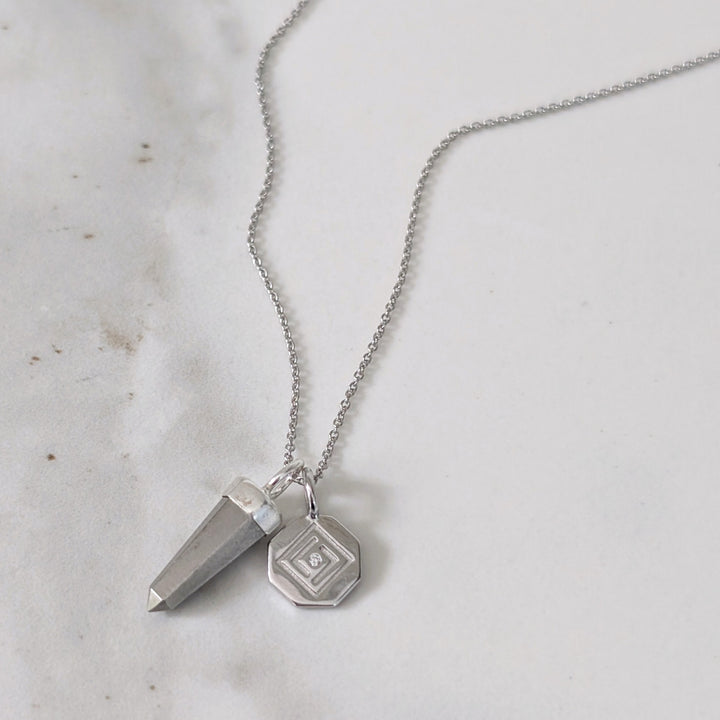 Silver necklace with a pyrite spike pendant and silver disc