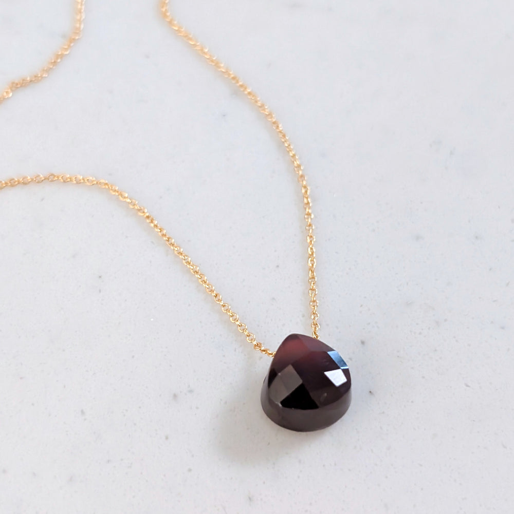 garnet January birthstone necklace on gold chain 