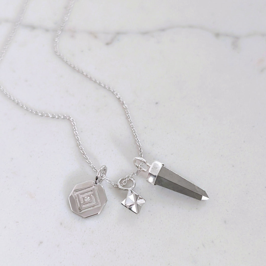 sterling silver necklace with pyrite, tetrahedron star and disc pendant charms