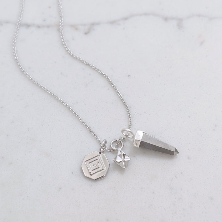 sterling silver necklace with pyrite, tetrahedron star and disc pendant charms