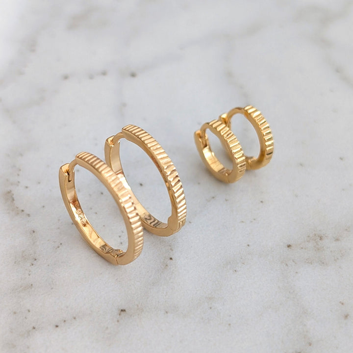 pair of gold textured hoop earrings