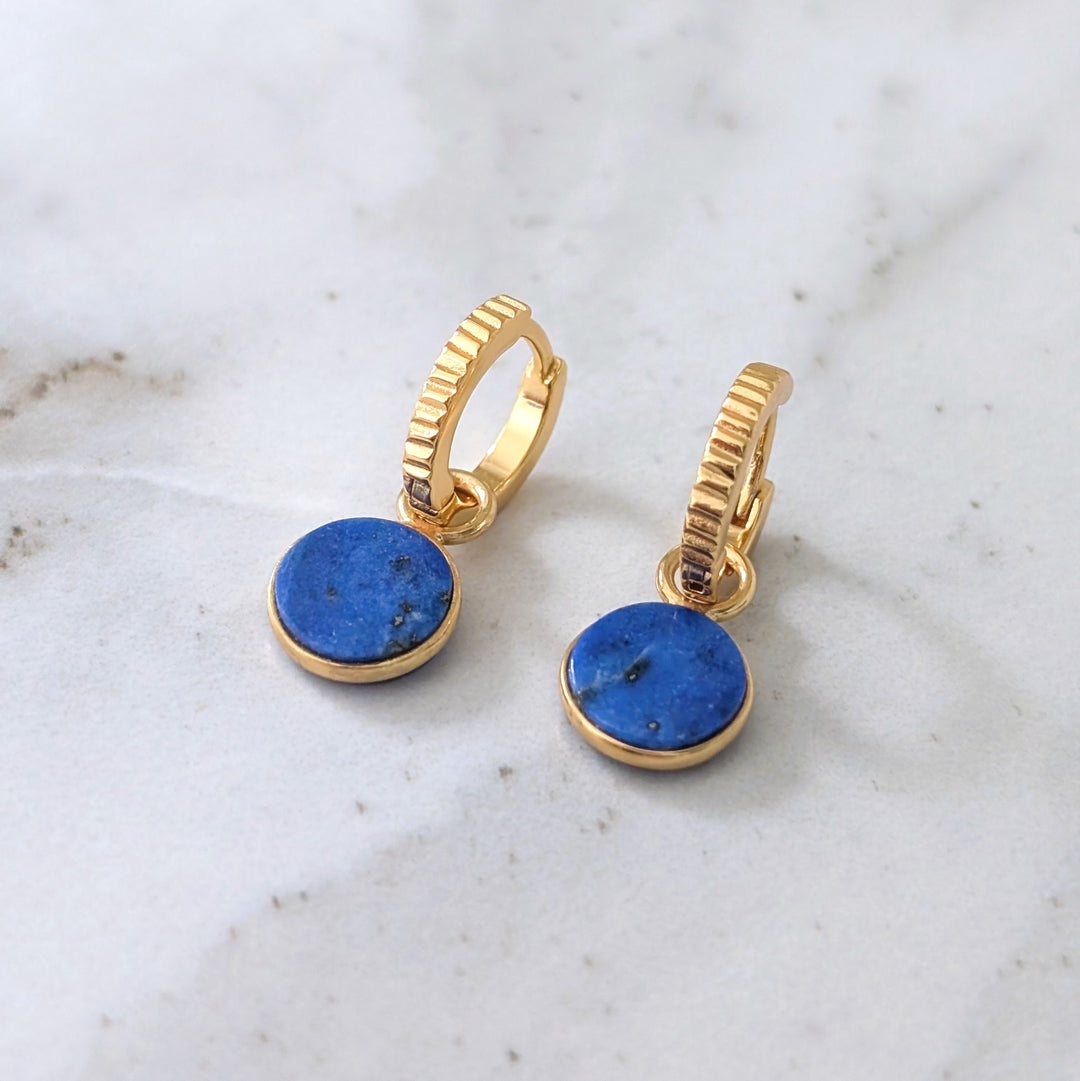 gold hoop earrings with lapis lazuli circular charms
