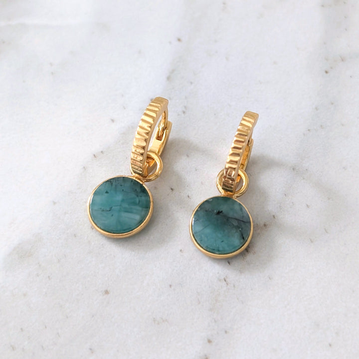 gold hoop earrings with emerald circular charms 