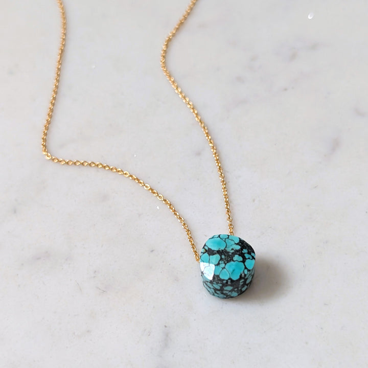 gold chain with turquoise faceted December birthstone pendant