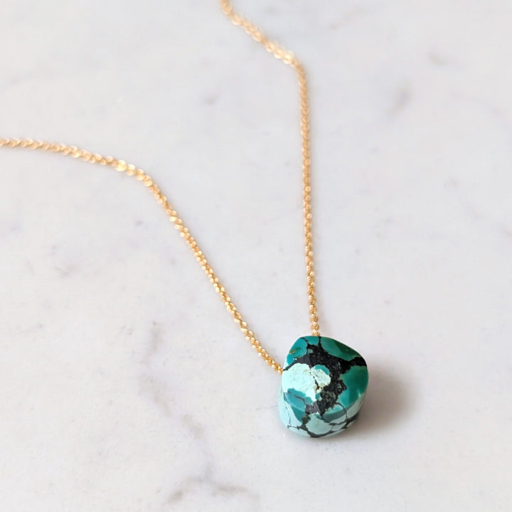 gold chain with turquoise faceted December birthstone pendant