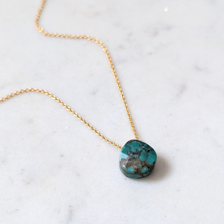 gold chain with turquoise faceted December birthstone pendant