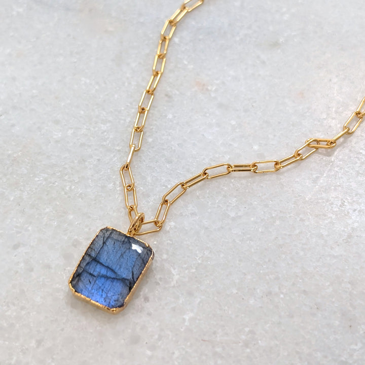 Gold paperclip necklace with a rectangular labradorite pendant