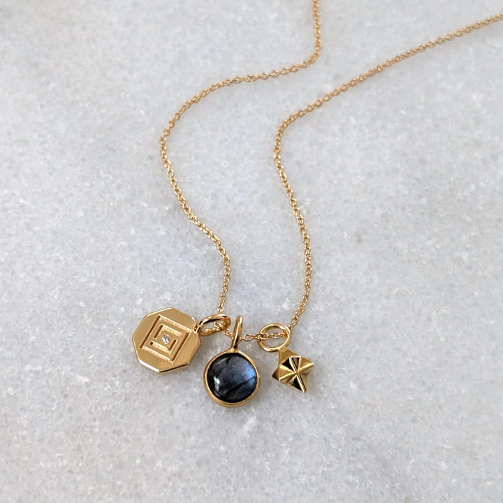 gold celestial necklace with labradorite, tetrahedron star and disc charms