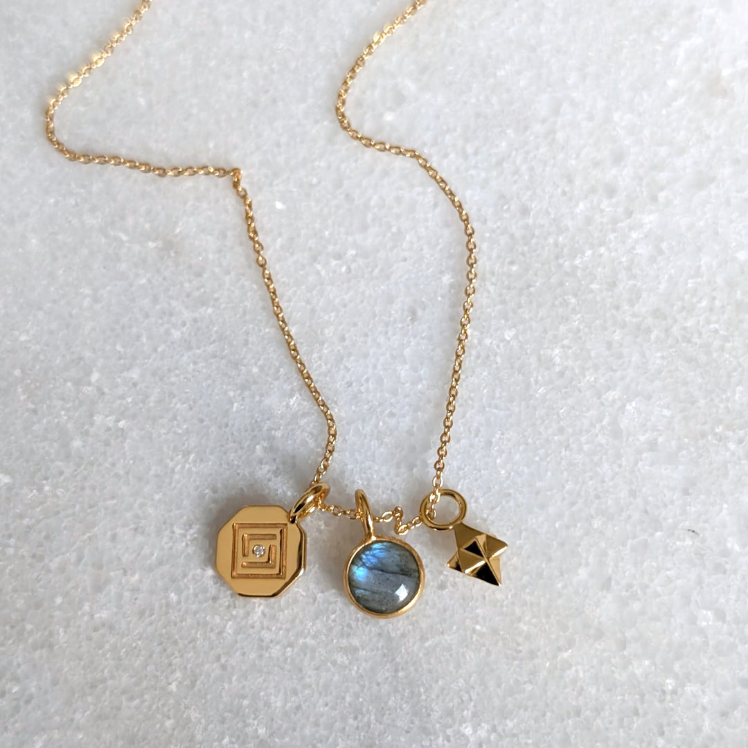 gold celestial necklace with labradorite, tetrahedron star and disc charms