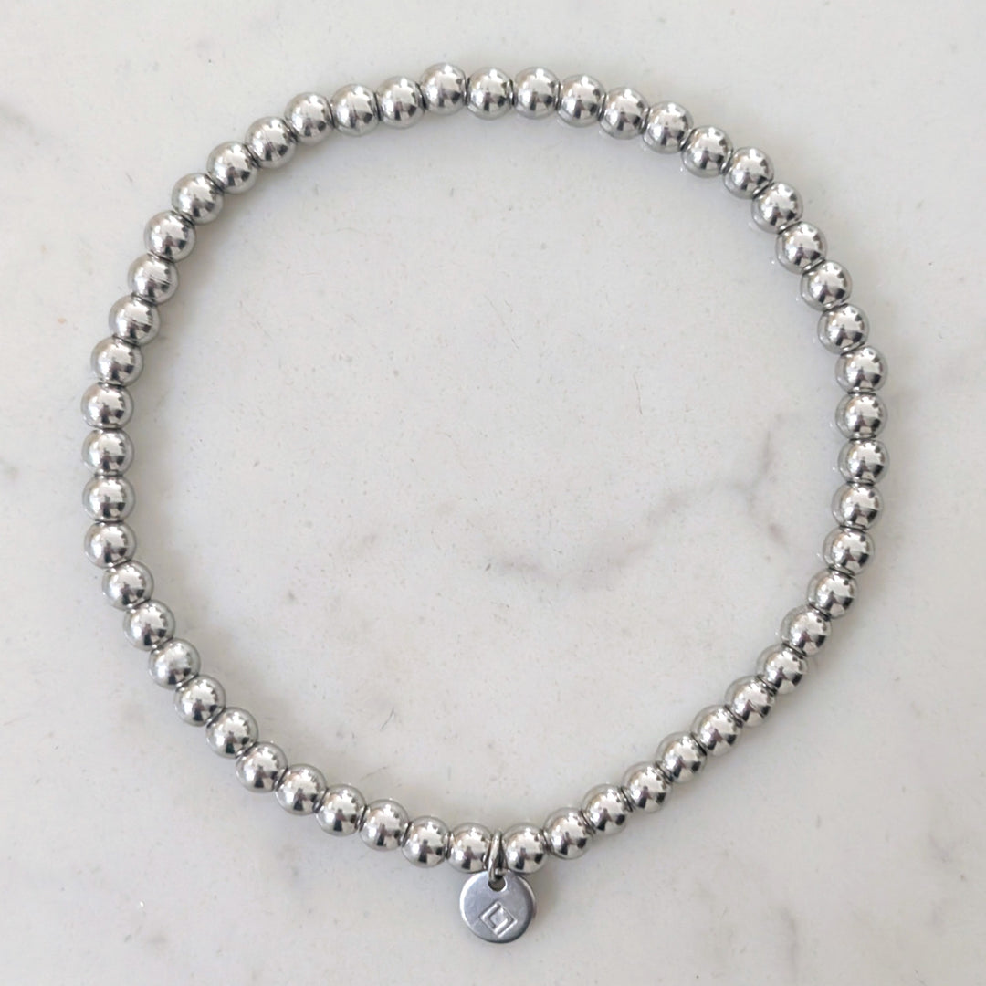 A silver stainless steel PVD beaded stretch bracelet