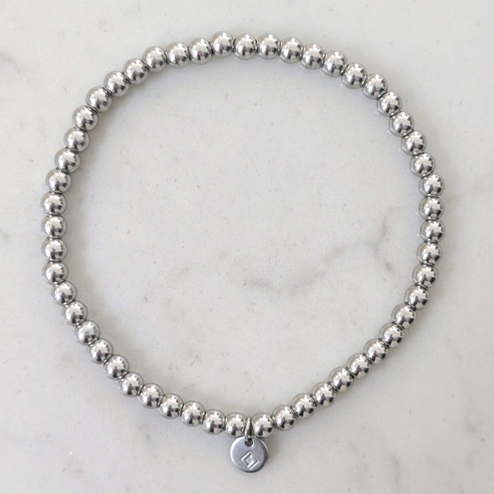 A silver stainless steel PVD beaded stretch bracelet