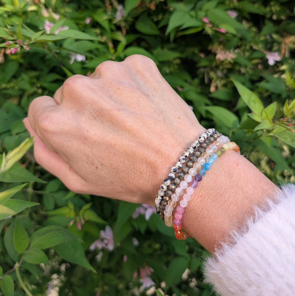 good vibes and rainbow bracelet gemstone bracelet set comprising citrine, dalmatian jasaper, pyrite and rainbow bracelets.