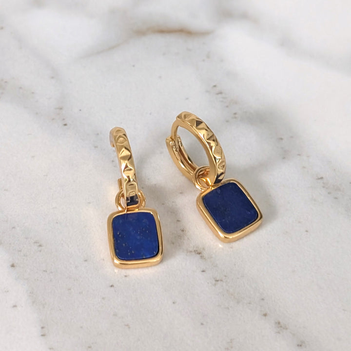 A pair of gold lapis lazuli Athena square charm gemstone hoop earrings 