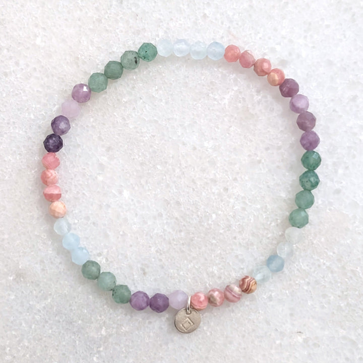 good luck and new ventures gemstone intention bracelet, comprising lepidolite, rhodochrosite, green aventurine and aquamarine faceted beads