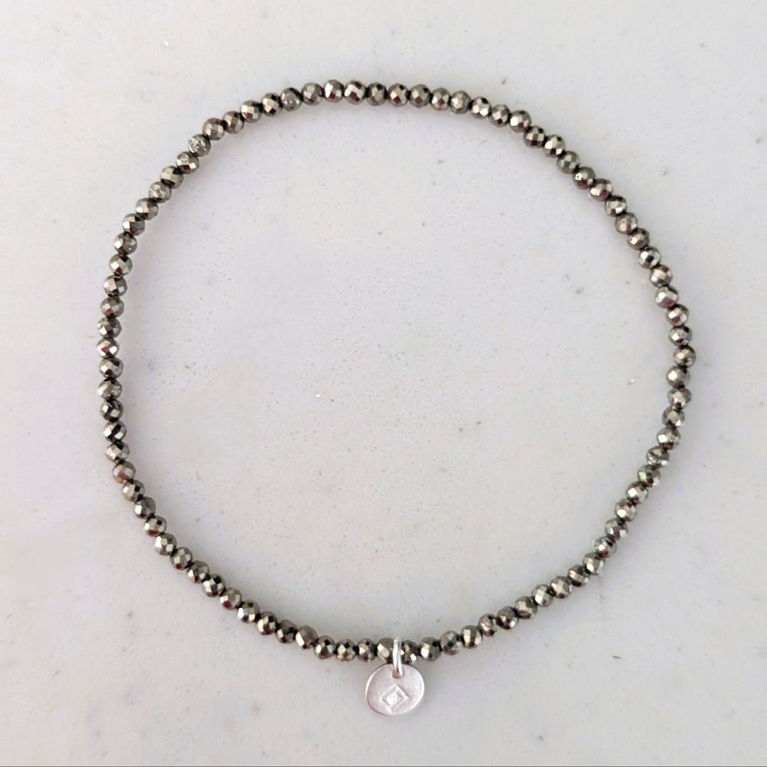 pyrite 2mm faceted bead elasticated gemstone bracelet