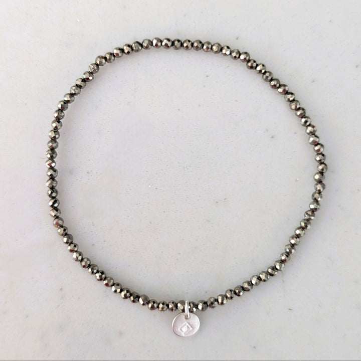 pyrite 2mm faceted bead elasticated gemstone bracelet